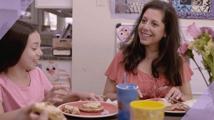 Thumbnail of two women sitting at a table used for an Ibrance (palbociclib) Ambassadors video, featuring Tami, an Ibrance ambassador