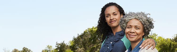 Two women standing outside